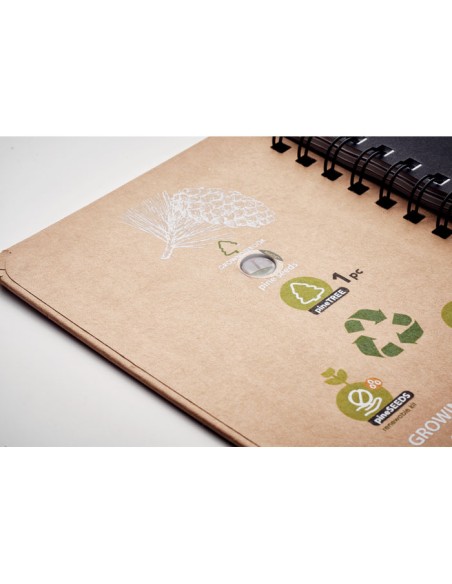 Cuadernos de papel con semillas y hojas rayadas